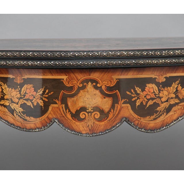 An exhibition quality 19th Century free standing French ebonised marquetry & ormolu card table crossbanded in Kingwood,...