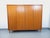 Vintage Scandinavian-style wardrobe from the 1960s, made of teak, with splayed legs and a light wood interior. Ample...