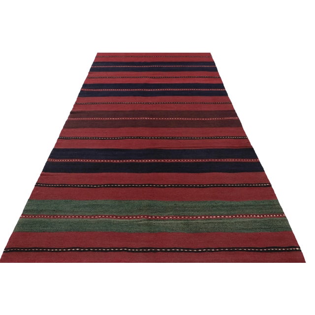 This vintage 6x11 Persian kilim is a mid-century Bakhtiari tribal rug, handwoven in wool circa 1950-1960. On the Design:...