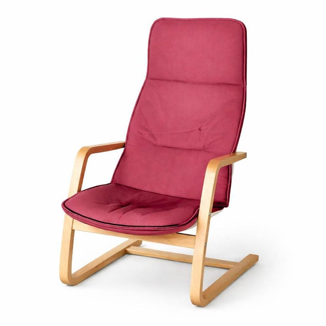 An iconic POÄNG bentwood armchair by IKEA , often affectionately referred to as the “Kangaroo” chair due to its sprung...