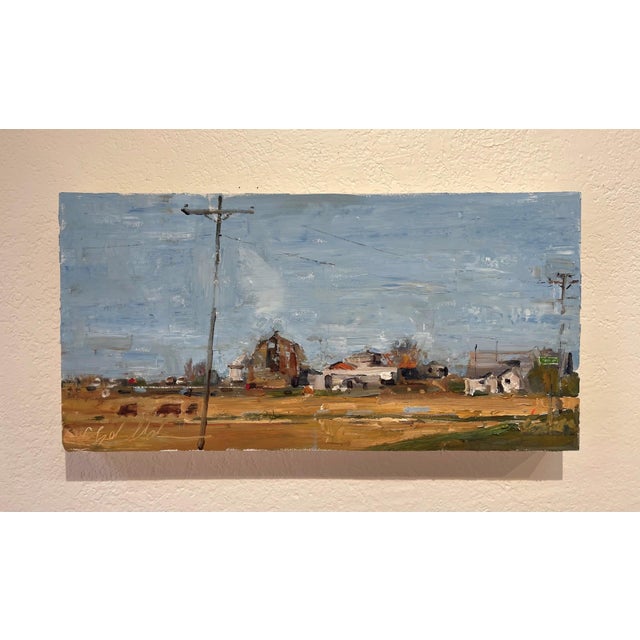 This oil painting captures a serene rural landscape, depicting a winding country road flanked by a cluster of farm...
