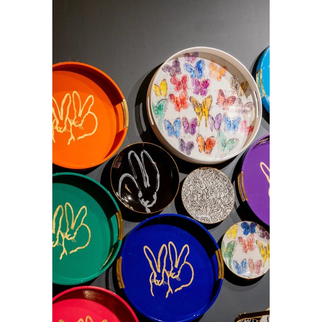 Artfully designed ceramic plate featuring one of Hunt Slonem's favorite bunnies on the front and a fluffle of bunnies...