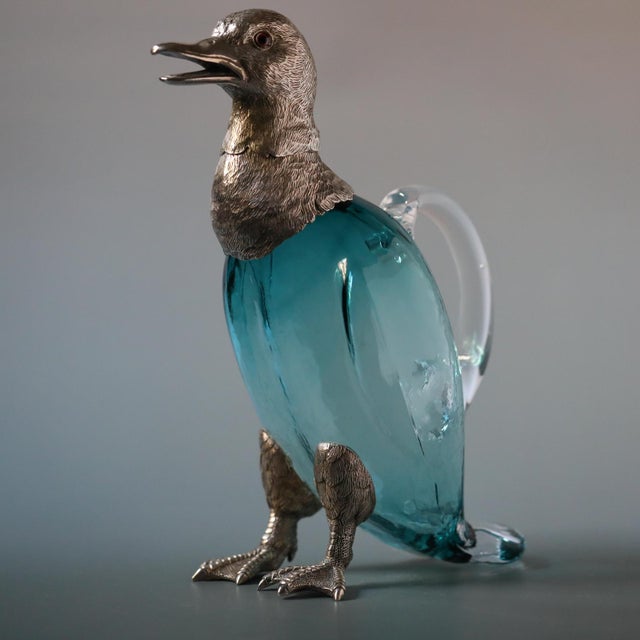 An unusual and highly decorative French zoomorphic ewer dating to the mid-to-late 19th century, modeled in the form of a...