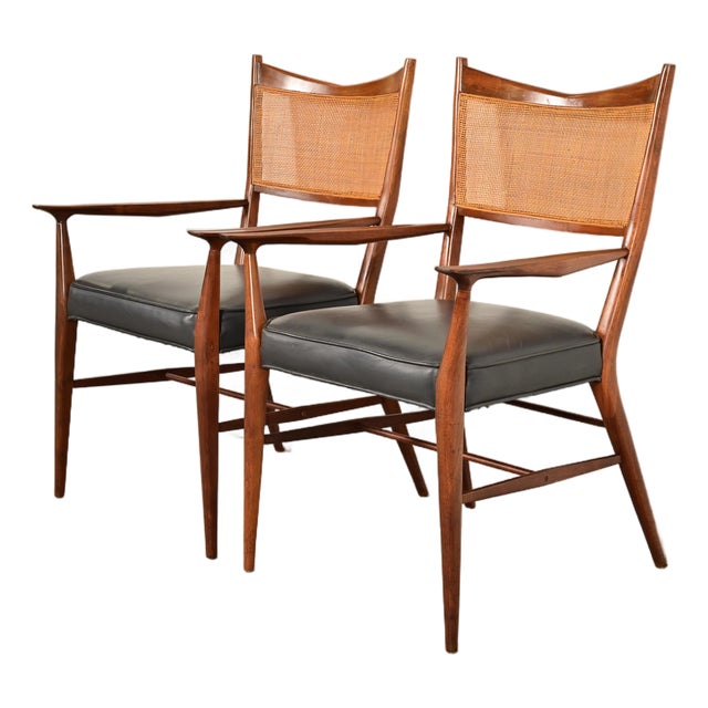 Paul McCobb for Directional Mid-Century Modern Sculpted Walnut Cane Back Armchairs, Pair For Sale