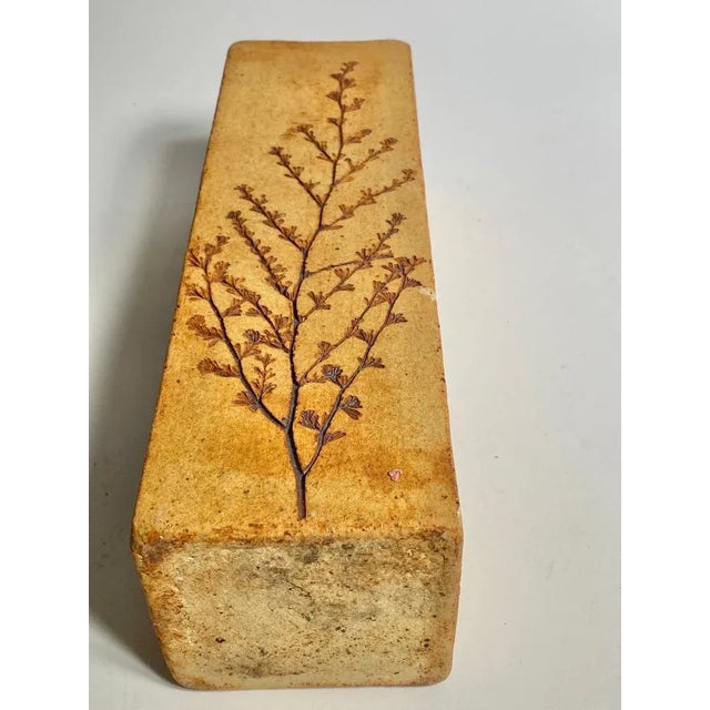 Vase in Sandstone, in a brown color. with leaves decor pattern. French Riviera, it has been made in France circa 1960.