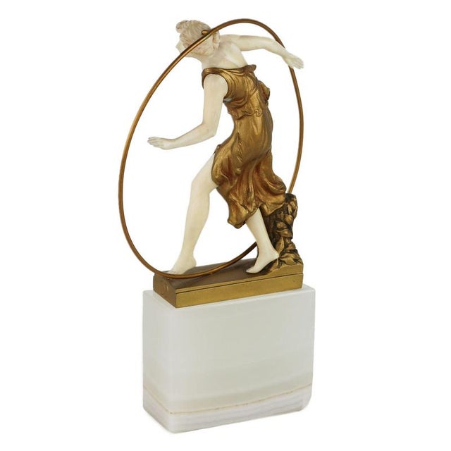 Chryselephantine bronze and ivory figurine Woman with a Hoop. Created by Georges Morin in 1920, this exquisite figurine is...