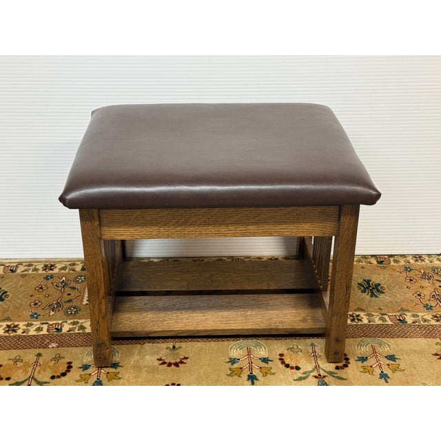 Design Plus Gallery presents a Vintage Arts and Crafts Leather Bench. This compact bench pairs a thick, padded leather...
