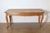 This 19th-century French farm table is a charming example of rustic craftsmanship and practicality. Constructed from...