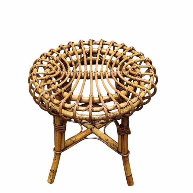 A round stool in curved rattan and bamboo from the mid-20th century, designed by Francesco Albini. Albini was among the...