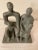 Austin Production sculpture After Henry Moore’s Family Group. Sculpture of a Father and Mother with son and daughter. In...