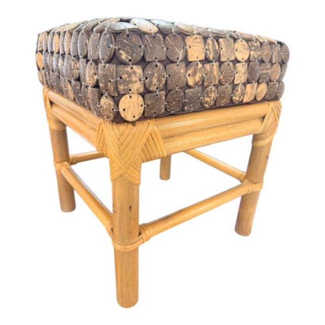 Unique vintage tropical-style stool featuring a beautifully crafted rattan frame with intricate wrapped and woven...