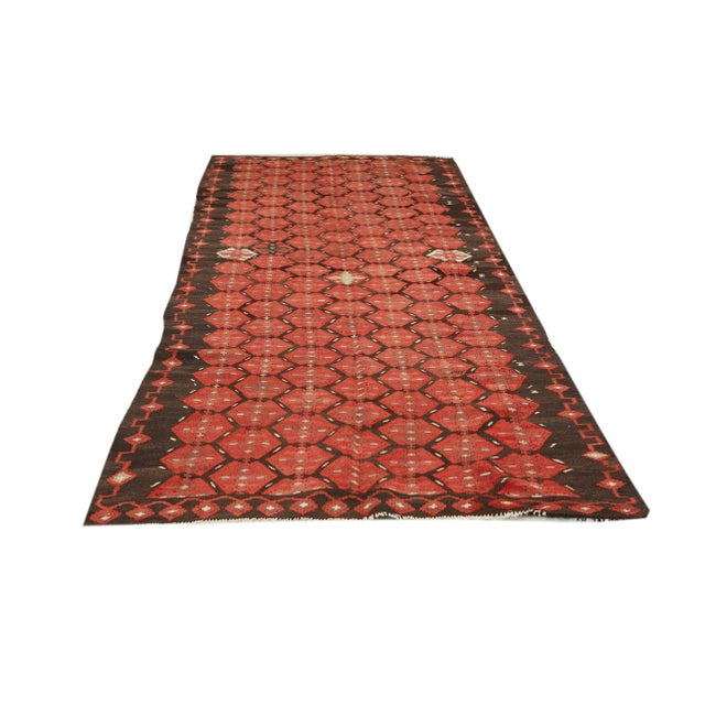 Decorative handwoven vintage kilim rug from Kars region of Turkey. Approximately 50-60 years old. In very good condition.