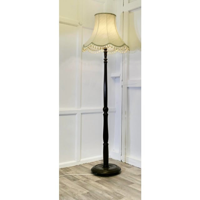 Carved and Turned Floor Lamp, Standard Lamp This lamp stands on a turned wooden base and has a turned upright column, it...