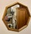 Large Gilt octagon Faux bamboo mirror. Measures 17.75" high x 17.75" wide x 1" deep. Two hooks on back for hanging two...