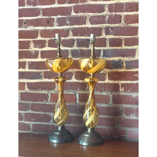 Beautiful pair of larger table lamps featuring the trademark Italian swirl and showcasing rich amber and cream hues that...