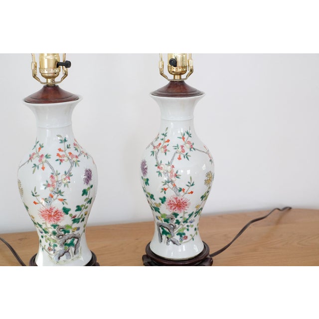 Beautiful pair of Chinese famille rose hand-painted porcelain lamps. These are in good condition for the age.