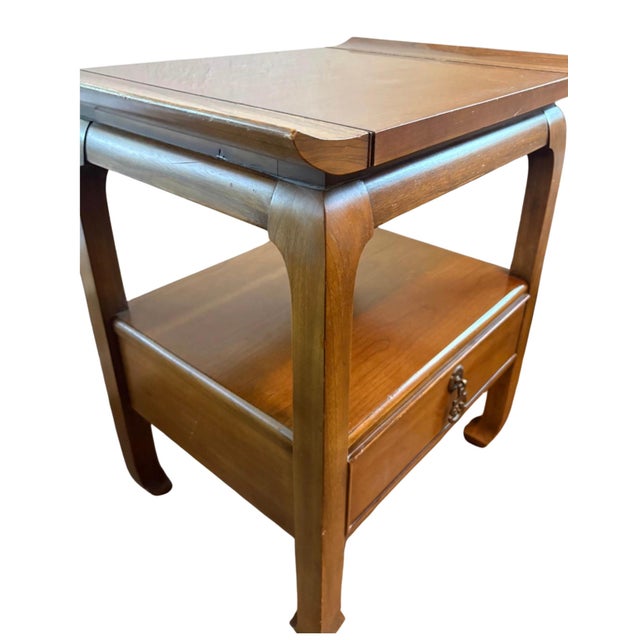 An authentic Kent-Coffey “The Amerasia” one-drawer nightstand or end table featuring the collection’s distinctive Asian...