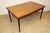 Extendable teak dining table with a clean and refined Scandinavian design. A Danish piece from the 1960s, bearing its...