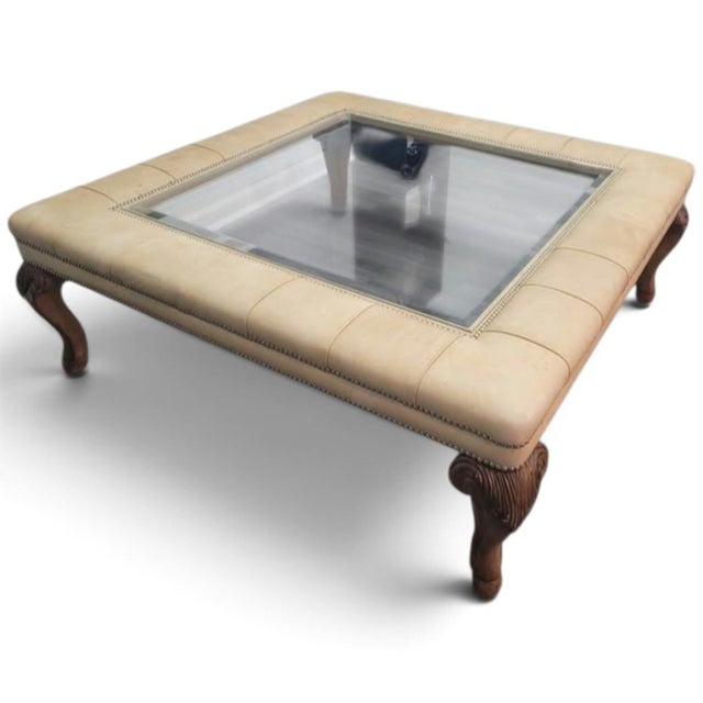 Elevate your living room with this timeless masterpiece Coffee Table from Maitland-Smith. This large, square executive-...