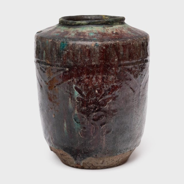 A beautiful example of Chinese folk pottery, this stoneware jar is an early 19th-century pickling pot once used for...