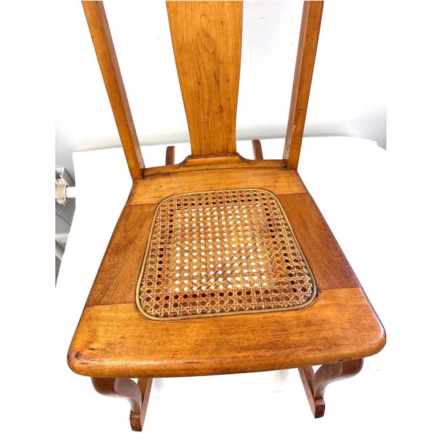 Small T-back slipper rocker by The Stomps-Burkhardt Co., Dayton, Ohio, with original paper maker's label. Hardwood frame,...