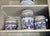 This is a set of three graduated, ceramic kitchen storage canisters featuring the classic Blue Willow chinoiserie pattern....