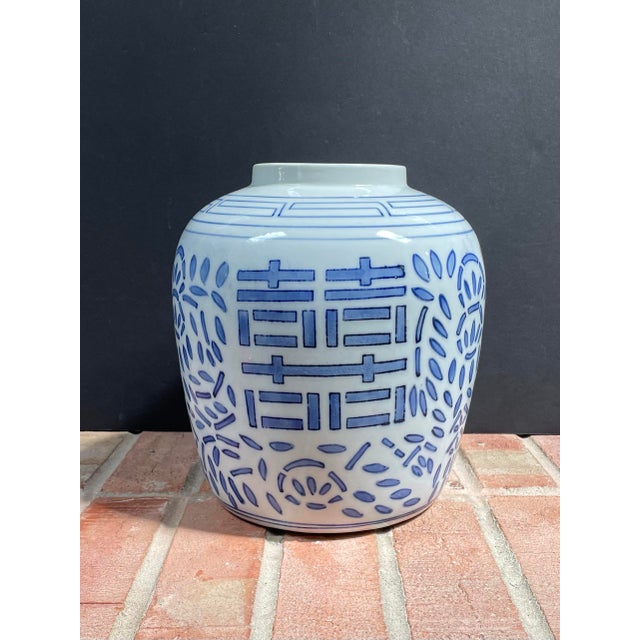 Traditional double happiness porcelain ginger jar (without lid) features a more modern script with navy & cornflower blue...