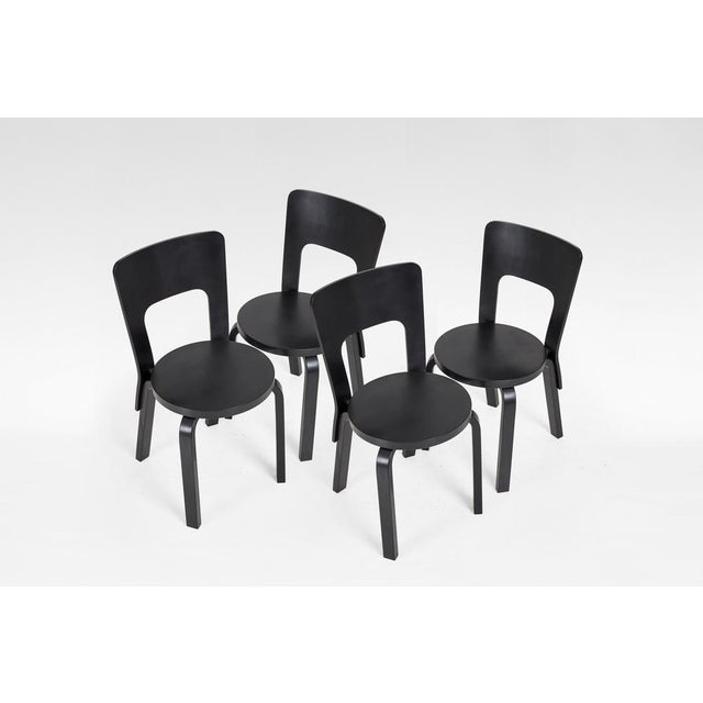 Set of four Model 66 dining chairs by Alvar Aalto for Artek, designed in Finland in the 1930s. Featuring Aalto’s signature...