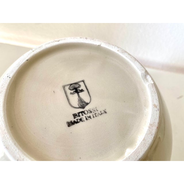 Creamy white Bitossi bowl with gold leaf design. Attributed to Bitossi and is stamped on the bottom with their logo