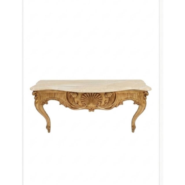 Elevate your interior with this stunning, heavily carved Monumental wall-mounted console table, a masterclass in classic...