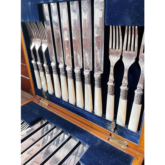 A beautiful antique circa 1890-1910s dessert or luncheon flatware service for 12 in it's original velvet-lined wood case...