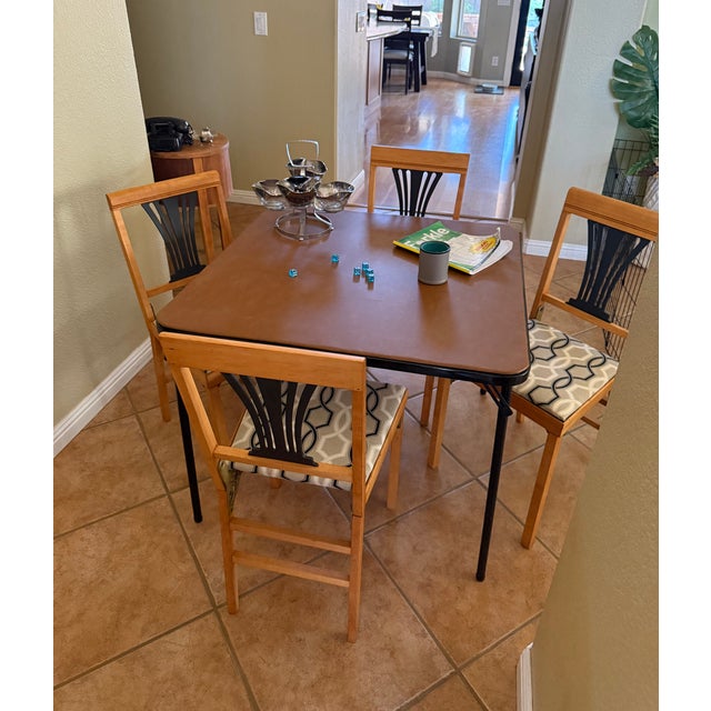 Beautifully refinished vintage folding chairs. These chairs have seated guests for Wednesday night Canasta and cocktails...