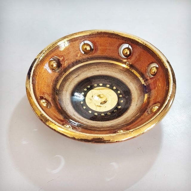 A ceramic bowl with a cutout design, decorated with spherical discs, by Georges Pelletier, 1970s. A unique piece made of...