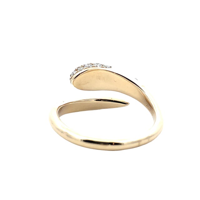 Striking vintage serpent-style snake ring crafted in solid 14K yellow gold, featuring a coiled wrap design with a diamond-...