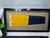 Genuine international maritime signal flag in a custom shadowbox frame. The cotton flag represents numeral "5". The...