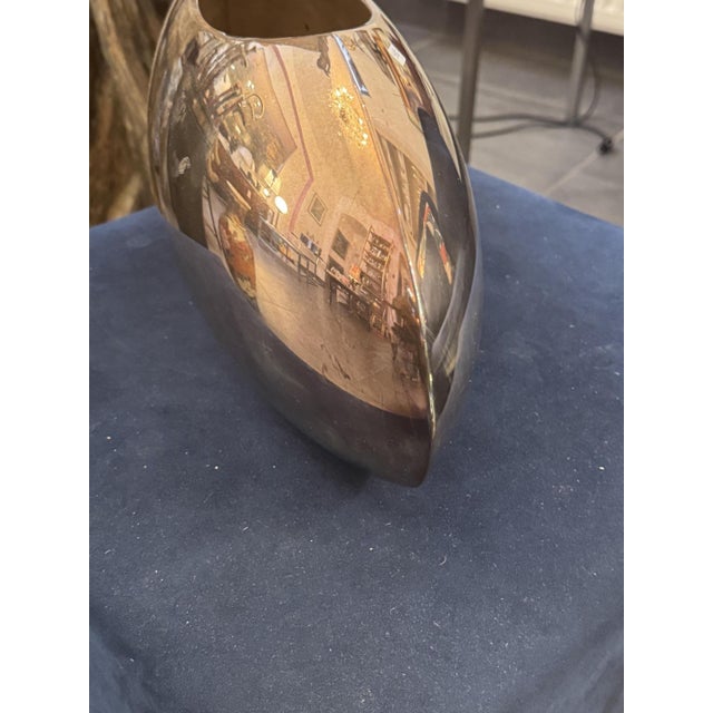 Elliptical vase by Lino Sabattini, 1970s Made of highly polished stainless steel or silver-plated metal In good, used...