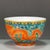 This is a striking vintage porcelain bowl, decorated in the wucai palette with vibrant polychrome enamels. The bowl...