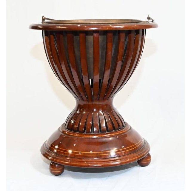 An unusual Dutch teestoof dating to around 1880, now displayed as a decorative planter The deep, openwork bowl has a...