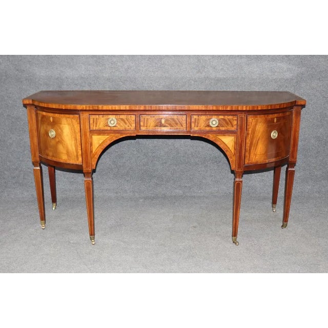 A stunning example of late 20th-century luxury, this mahogany sideboard by the renowned Baker Furniture Co. combines...