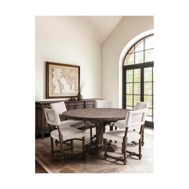 The chair brings together classic style and Spanish-inspired design. Its Dark Walnut finish shows off the natural wood...