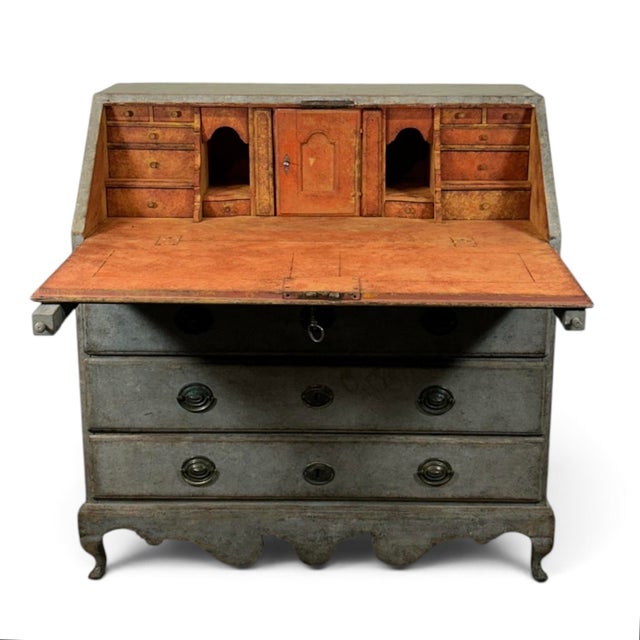 A beautiful antique Secretary in grey with a touch of blue and a beautiful patina. The lid is decorated with two panels....