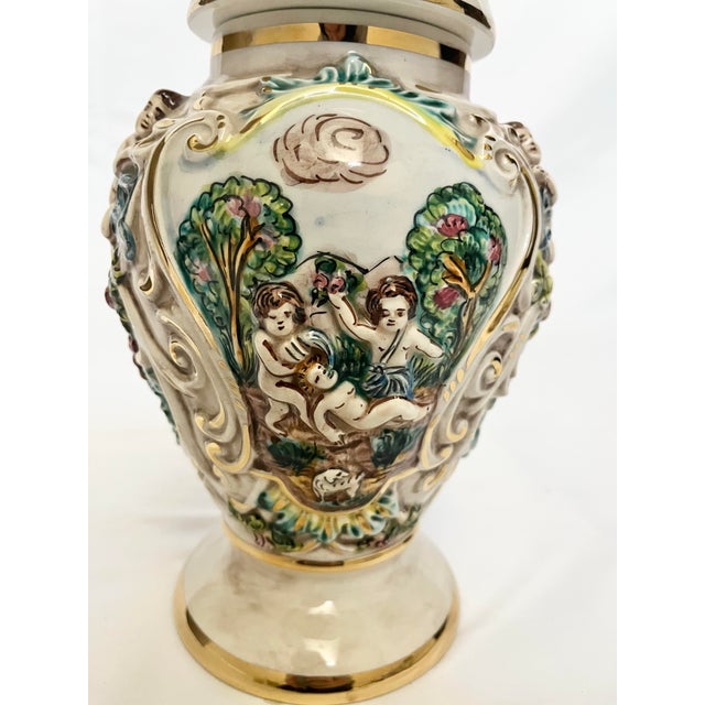 This is a beautiful vintage Capodimonte covered jar, crafted in Italy and richly decorated in the classic Capodimonte...