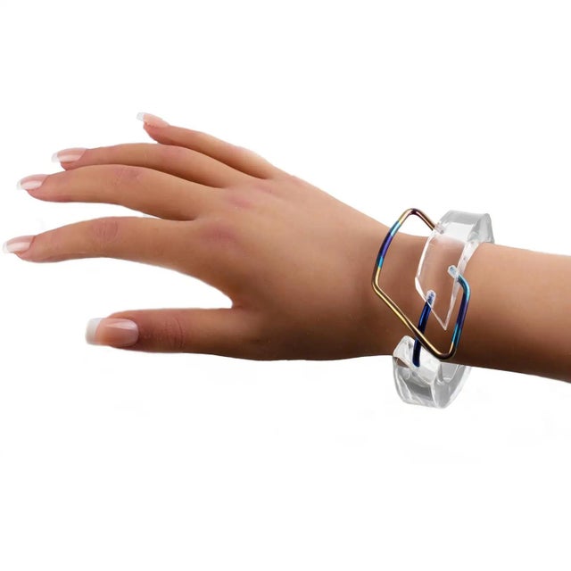This stunning Space Age sculptural Lucite bracelet bangle features a chunky hand-crafted, open twisted thick band shape in...