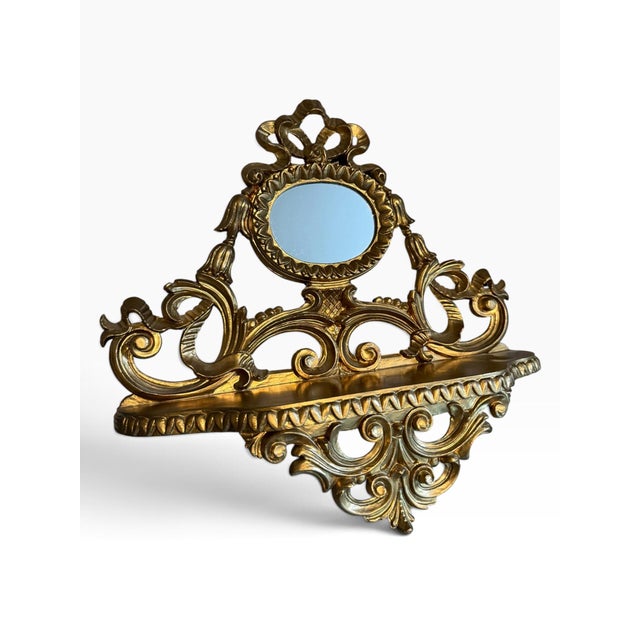 Elegant vintage Italian wall-mounted mirror shelf by Euromarchi S.r.l., Italy, featuring an ornate Florentine-inspired...