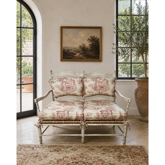 This charming two-seat settee showcases a classic French-style frame with a rush seat, gracefully elevated on cylindrical...