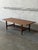 This elegant rectangular coffee table features a beautifully contoured top with subtly tapered edges. The sturdy...