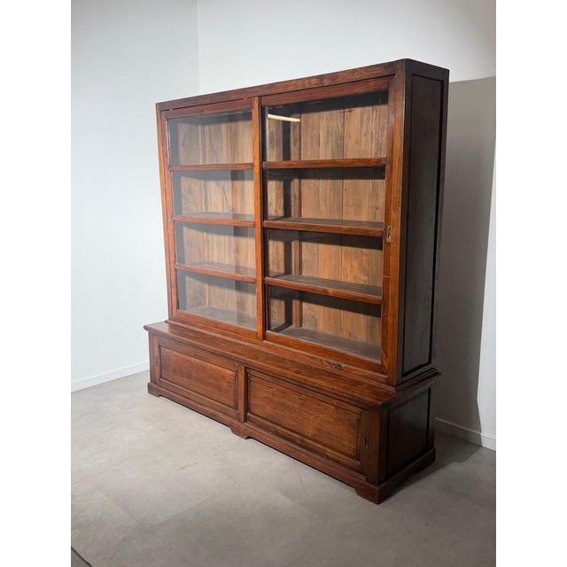Teak sliding door display cabinet large and characterful teak display cabinet featuring a practical combination of glazed...