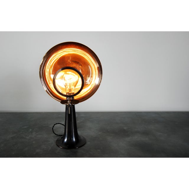 Before the days of electricity, this was a candle holder used by the doctors. The reflector concentrates the beam and the...