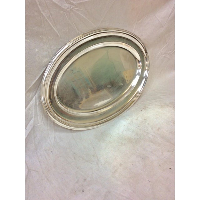 This Early 20th Century French Hotel Silver Silverplate Serving Platter is hallmarked with small symbols on the underside....