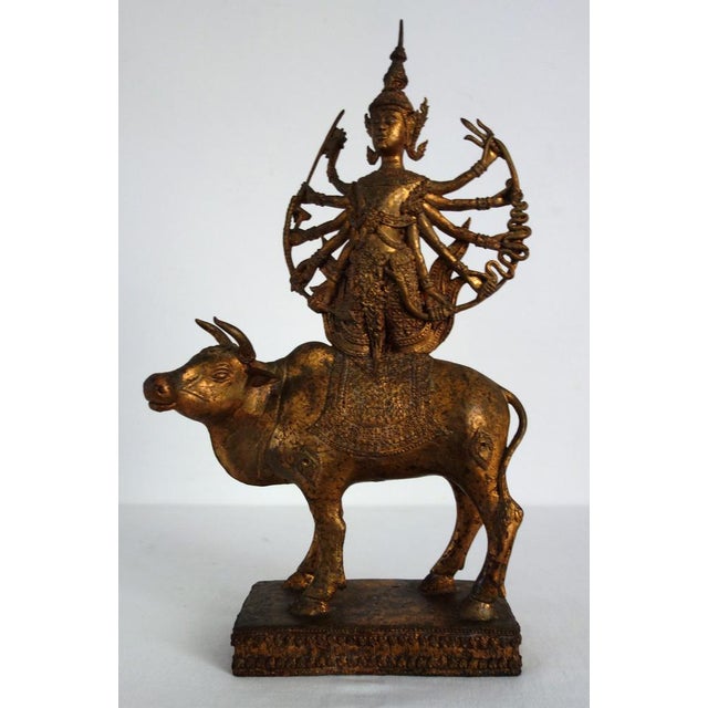 Impressive mid-20th-century gilt bronze statue from India. This bold statue depicts Shiva on his mount, the bull Nandi,...